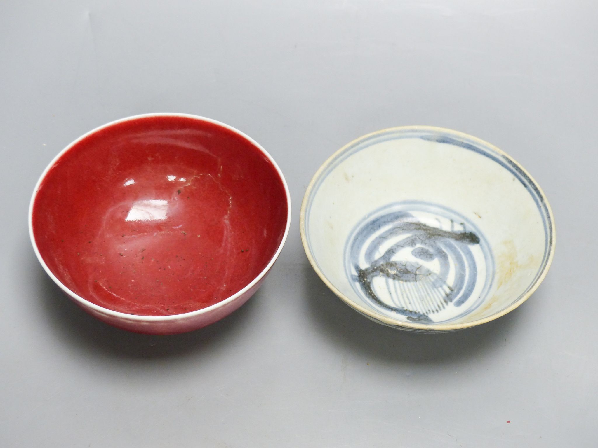 A Chinese sang de boeuf bowl and a blue and white bowl, 12.7cm